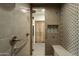 Spa-like shower with tiled walls, a built-in bench, and designer accents, ensuring a serene experience at 10596 E Yearling Dr, Scottsdale, AZ 85255