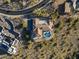 Aerial view of home featuring a tile roof, landscaping, a beautiful backyard pool, and neighboring buildings at 11320 N Crestview Dr, Fountain Hills, AZ 85268