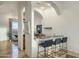 Charming home bar area with marble countertops, seating, and stylish archways at 11320 N Crestview Dr, Fountain Hills, AZ 85268