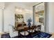 Elegant dining room features a modern chandelier, stylish blue rug and large windows with patterned drapes at 11320 N Crestview Dr, Fountain Hills, AZ 85268