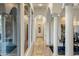 Bright hallway with tile flooring, columns, archways, and natural light at 11320 N Crestview Dr, Fountain Hills, AZ 85268
