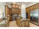 Gourmet kitchen boasts granite countertops, custom wood cabinets, stainless steel appliances and a center island at 11320 N Crestview Dr, Fountain Hills, AZ 85268