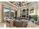 Spacious living room featuring a fireplace, elegant built-ins, and views of the outdoor landscape at 11320 N Crestview Dr, Fountain Hills, AZ 85268