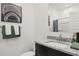 Bathroom featuring granite countertop, stainless steel faucet, and decorative wall art at 11943 E Aster Ln, Florence, AZ 85132