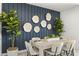 Cozy dining room with stylish decor, including a statement wall and elegant seating at 11943 E Aster Ln, Florence, AZ 85132