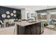 Bright, airy kitchen featuring an island with stainless steel appliances and a dining area at 11943 E Aster Ln, Florence, AZ 85132