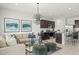 Stylish living room with an open layout connecting to the kitchen and dining area at 11943 E Aster Ln, Florence, AZ 85132