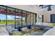 Cozy lounge area with comfortable couches and a view of the outdoor patio at 11943 E Aster Ln, Florence, AZ 85132