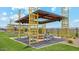 Stylish outdoor pavilion with seating and a fire pit, perfect for gatherings in the community at 11943 E Aster Ln, Florence, AZ 85132