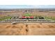 Aerial view of community amenities including swimming pools, playgrounds, and green spaces in a Primary-planned area at 11959 E Aster Ln, Florence, AZ 85132