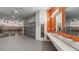 Well-lit communal bathroom featuring modern fixtures, lockers, and accessible amenities at 11959 E Aster Ln, Florence, AZ 85132