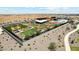 A bird's eye view of the community picnic area featuring multiple covered tables and a grassy lawn at 11959 E Aster Ln, Florence, AZ 85132