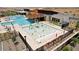 View of a community pool with water features, lounge chairs, and well-maintained surroundings at 11959 E Aster Ln, Florence, AZ 85132