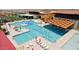 Community pool area featuring multiple pools, lounge chairs, and well-maintained landscaping for residents at 11959 E Aster Ln, Florence, AZ 85132