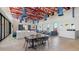 Spacious community room with comfortable seating, tables, and modern lighting fixtures at 11959 E Aster Ln, Florence, AZ 85132