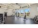 Well-equipped fitness center with modern exercise equipment and natural light from large windows at 11959 E Aster Ln, Florence, AZ 85132