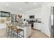 Stylish kitchen with island seating, stainless steel appliances, and ample counter space at 11959 E Aster Ln, Florence, AZ 85132