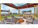 Cozy outdoor lounge area with a fire pit and comfortable seating, perfect for relaxing and socializing at 11959 E Aster Ln, Florence, AZ 85132