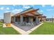 Inviting outdoor lounge area with comfortable seating and grill, perfect for socializing and relaxing at 11959 E Aster Ln, Florence, AZ 85132