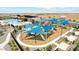 Community playground featuring shade structures, play equipment, and soft landing zones for Gathering enjoyment at 11959 E Aster Ln, Florence, AZ 85132