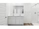 Bright bathroom with double vanity, large mirror, and a stand-up shower at 12443 E Bahia Ct, Florence, AZ 85132
