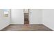 Bright bedroom with wood-look floors and a large closet with shelving at 12443 E Bahia Ct, Florence, AZ 85132