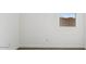 Cozy bedroom featuring a wood floor, a window offering outside view, and ample natural light at 12443 E Bahia Ct, Florence, AZ 85132
