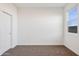 Bedroom with carpet and sliding closet door next to a window providing natural light at 12456 E Bahia Ct, Florence, AZ 85132