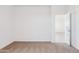 Carpeted bedroom with a bright neutral color scheme and a doorway at 12456 E Bahia Ct, Florence, AZ 85132