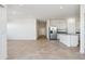 Open concept living area with tile floors and stainless steel appliances in the kitchen at 12456 E Bahia Ct, Florence, AZ 85132