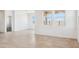 Spacious living area with multiple windows and an open doorway at 12456 E Bahia Ct, Florence, AZ 85132