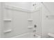 Bathroom featuring a white shower and tub combo with built-in shelves at 12456 E Bahia Ct, Florence, AZ 85132