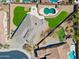 Expansive aerial view showcasing the home, well manicured yard, pool, and outdoor living space at 12493 S 179Th Ln, Goodyear, AZ 85338