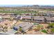 Aerial view of a residential neighborhood with pools, desert landscaping, and mountain views at 12493 S 179Th Ln, Goodyear, AZ 85338