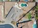 Aerial view of a backyard featuring a pool, patio area, desert landscaping at 12493 S 179Th Ln, Goodyear, AZ 85338