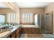 Well-appointed bathroom with double sinks, soaking tub, and walk-in shower at 12493 S 179Th Ln, Goodyear, AZ 85338