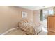 Cozy bedroom with a comfortable bed, a window, and tasteful decorations for a relaxing atmosphere at 12493 S 179Th Ln, Goodyear, AZ 85338