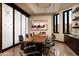Modern conference room featuring a sleek table, comfortable chairs, and a mounted display screen at 12493 S 179Th Ln, Goodyear, AZ 85338
