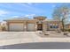Charming single-story home featuring a three-car garage, stone accents, and desert landscaping at 12493 S 179Th Ln, Goodyear, AZ 85338