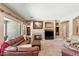 Cozy living room with fireplace, comfortable seating, and plenty of natural light at 12493 S 179Th Ln, Goodyear, AZ 85338