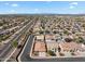 High angle view of a residential neighborhood with well manicured lawns and desert landscape at 14694 W Mandalay Ln, Surprise, AZ 85379