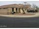 A corner lot home with manicured landscaping and a three-car garage at 14694 W Mandalay Ln, Surprise, AZ 85379