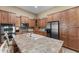 Bright kitchen featuring an island sink, stainless steel appliances, and ample cabinet space for storage at 14694 W Mandalay Ln, Surprise, AZ 85379