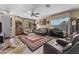 Bright living room boasting large windows, neutral tones, and a decorative rug at 14694 W Mandalay Ln, Surprise, AZ 85379