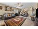 Spacious living room featuring a neutral color palette, piano, and unique decor at 14694 W Mandalay Ln, Surprise, AZ 85379