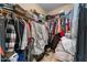 Walk-in closet with ample storage space, shelving, and hanging racks for organized clothing and accessories at 14694 W Mandalay Ln, Surprise, AZ 85379
