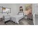 Cozy bedroom with natural light, neutral tones, and a decorative dresser at 15691 N 104Th Pl, Scottsdale, AZ 85255