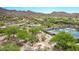 Aerial view of a desert landscaped community park with pool, playground, tennis and pickleball courts at 15691 N 104Th Pl, Scottsdale, AZ 85255