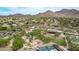 Aerial image of a community park, pool, and other amenities in a desert landscape with mountain views at 15691 N 104Th Pl, Scottsdale, AZ 85255