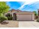 Charming single-story home features a two-car garage and well-manicured landscaping in a peaceful neighborhood at 15691 N 104Th Pl, Scottsdale, AZ 85255